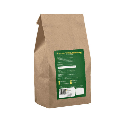 Braune Papiertüte mit grünem Etikett und Barcode, aufrecht stehend auf weißem Hintergrund - ideal zur Unterstützung der Verdauung von Pferden mit Pferdegold Verdauungsglück, einem bewährten Verdauungsergänzungsmittel für Pferde.